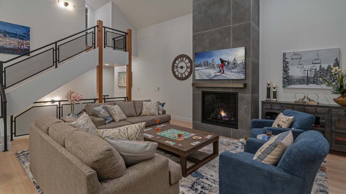 Enjoy family time in the great room on the main level with TV and fireplace - Image 6