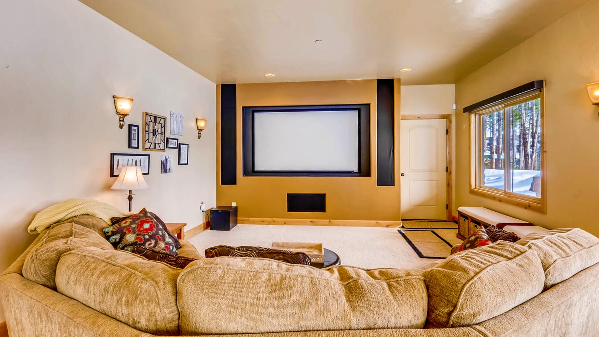Large projection TV and comfortable sectional on lower level - Image 21