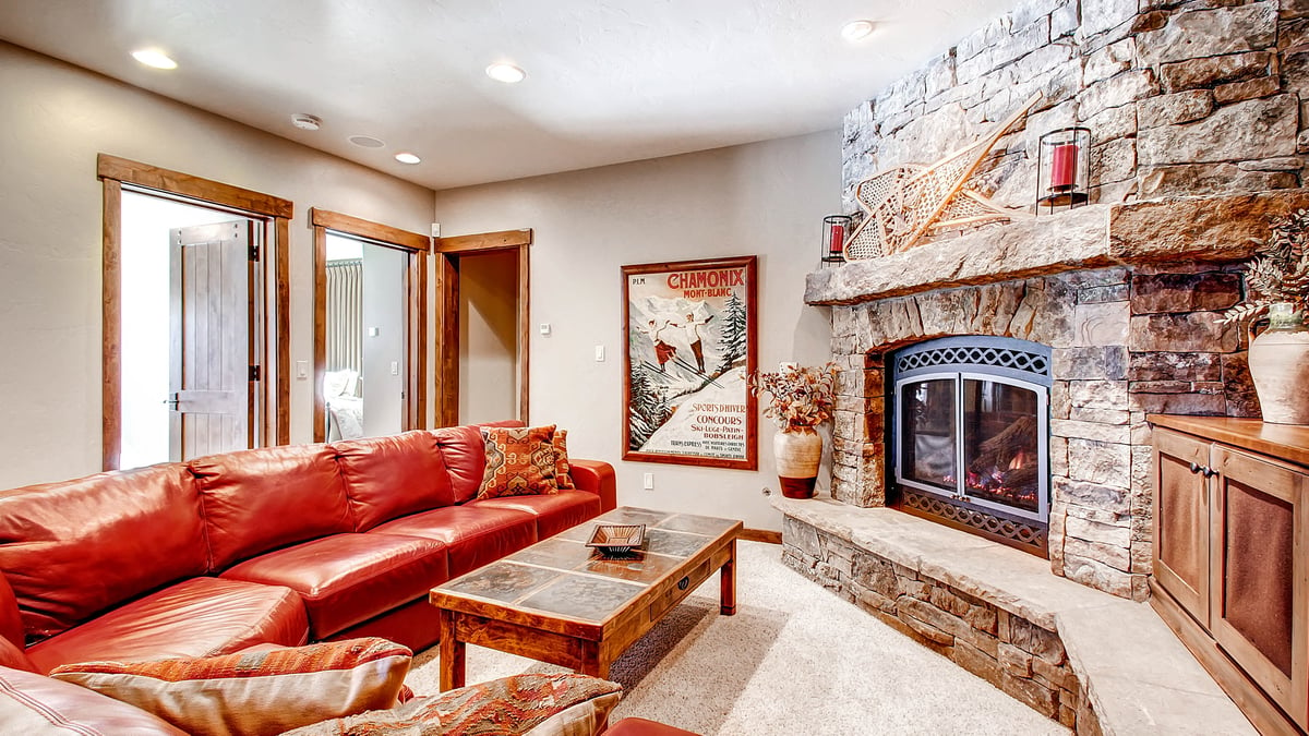 Lower level family room with TV, fireplace - Image 25