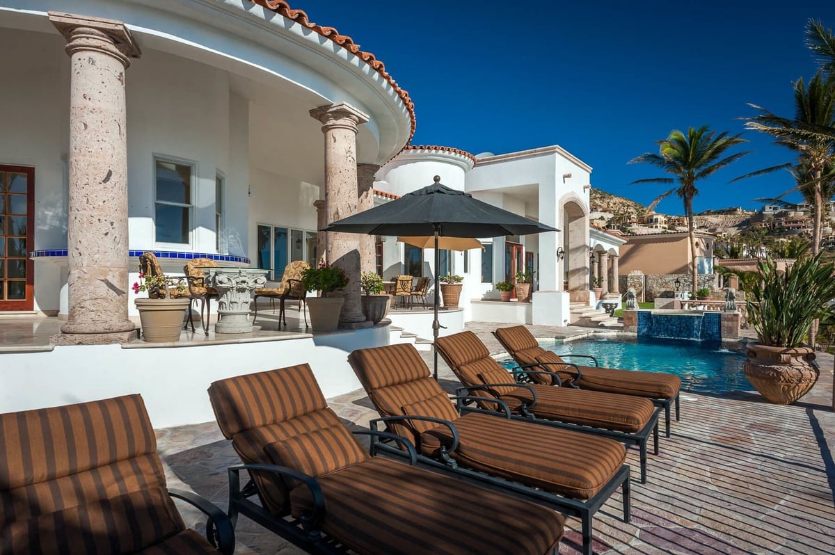 Relax and soak up some of the warm Cabo sun on one of the many lounge chairs found along the terrace - Image 7