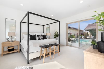 Primary en-suite bedroom with direct access to the pool