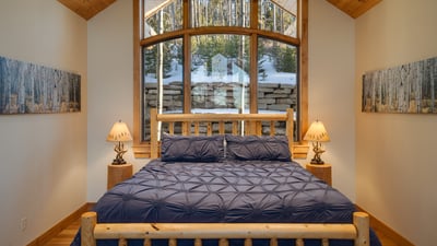 Family suite on upper level with king bed, full bunk bed, ensuite bath