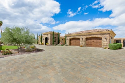 Grand main entrance with wrap around driveway