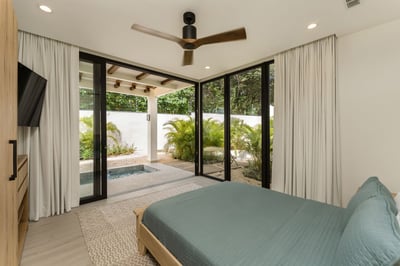 - Wake up to views of greenery and sunshine through the full glass sliding doors
- Lounge in bed wit
