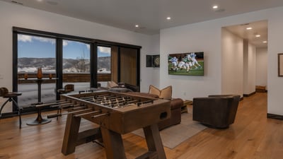 Lower level family room, with foosball table and game table, wet bar