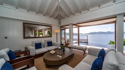 Living Area: Great room, ocean-view lounge, ceiling fans. In a separate room, HD-TV, DVD player