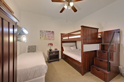 Guest bedroom 5 with bunk bed (full on top and bottom) plus additional twin bed.