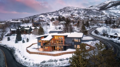Winter aerial of Cazador Lodge with ski resort in view