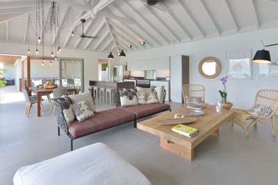 Living & Dining Area: A lounge area near the large American satellite television, located at the bac