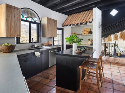 Kitchens always get a lot of love (and a lot of spills!), so we used quartzite, which is really dura
