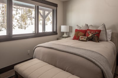 Wake up to breathtaking snowy mountain views from your cozy bedroom, where rustic charm meets modern