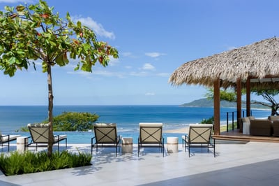 - Gaze out over shimmering blue waters while reclining on cushioned loungers
- Swaying trees and wid