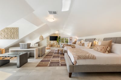 Opal: Guest bedroom four on the second floor with 3 Queen beds,  sitting area, writing desk and priv