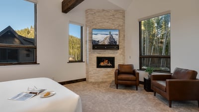 Primary suite with TV & fireplace