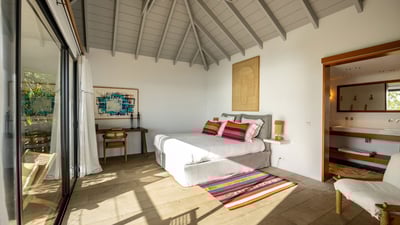 Bedroom 2: On an upper level. Master bedroom located in a separate bungalow, above the terrace. King