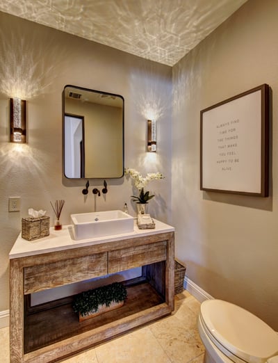 Guest bathroom with Restoration Hardware distressed wood vanity.