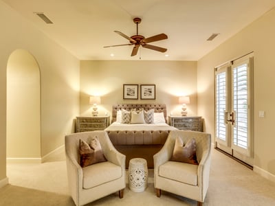 Primary bedroom with french doors to the backyard