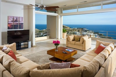 Floor-to-ceiling windows make it easy to move from the terrace into the open concept living and dini