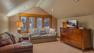 Loft level sitting area with queen sleeper sofa