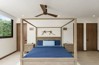 - Drift into comfort on a spacious four post bed dressed in rich blue linens
- Natural light pours i