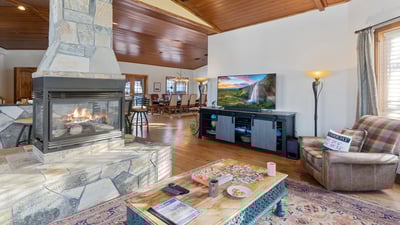 Great room with large TV, open to kitchen and dining