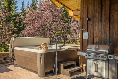 Soak away your cares in the hot tub while your grilled favorites cook nearby.