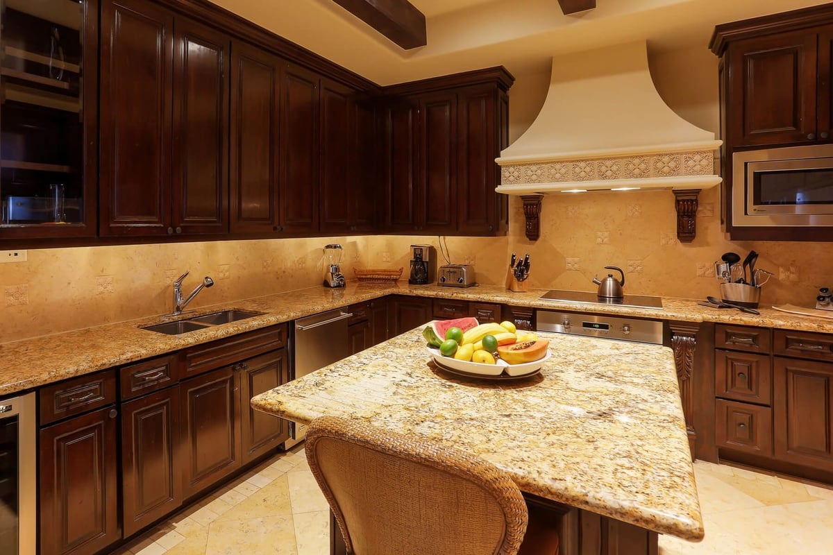 Granite counter tops complete the clean and professional look of the kitchen. - Image 9