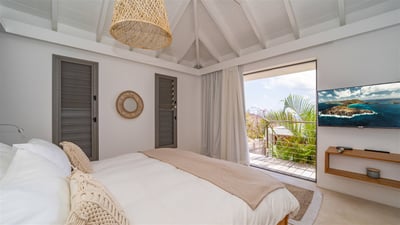 Bedroom 1: On an upper level, in a separate bungalow. King size bed, air conditioning, HD-
