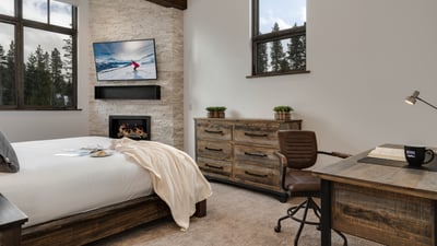 Primary bedroom with fireplace and desk