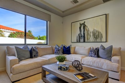 Media room with writing desk, large sectional sofa and HDTV