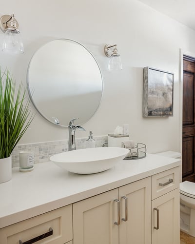 Second half bath off the living room for guests.