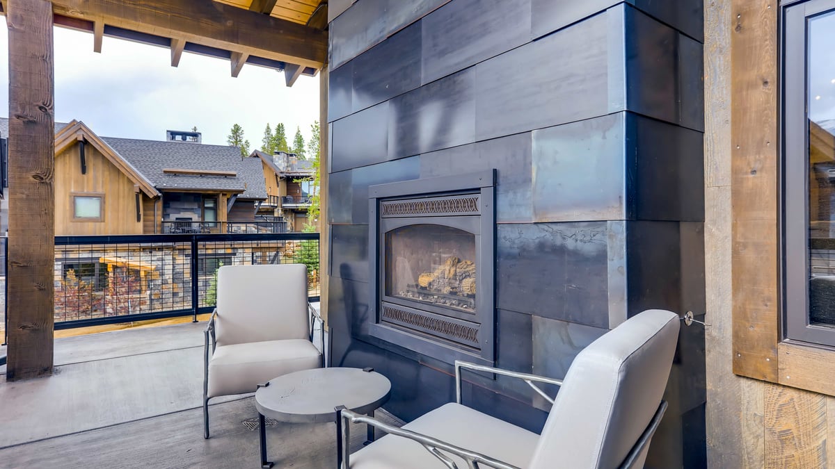 Primary suite outdoor seating and fireplace - Image 6