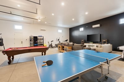 Show off your skills at a round of ping pong, corn hole or air hockey