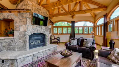 Warm up by the fireplace in the great room