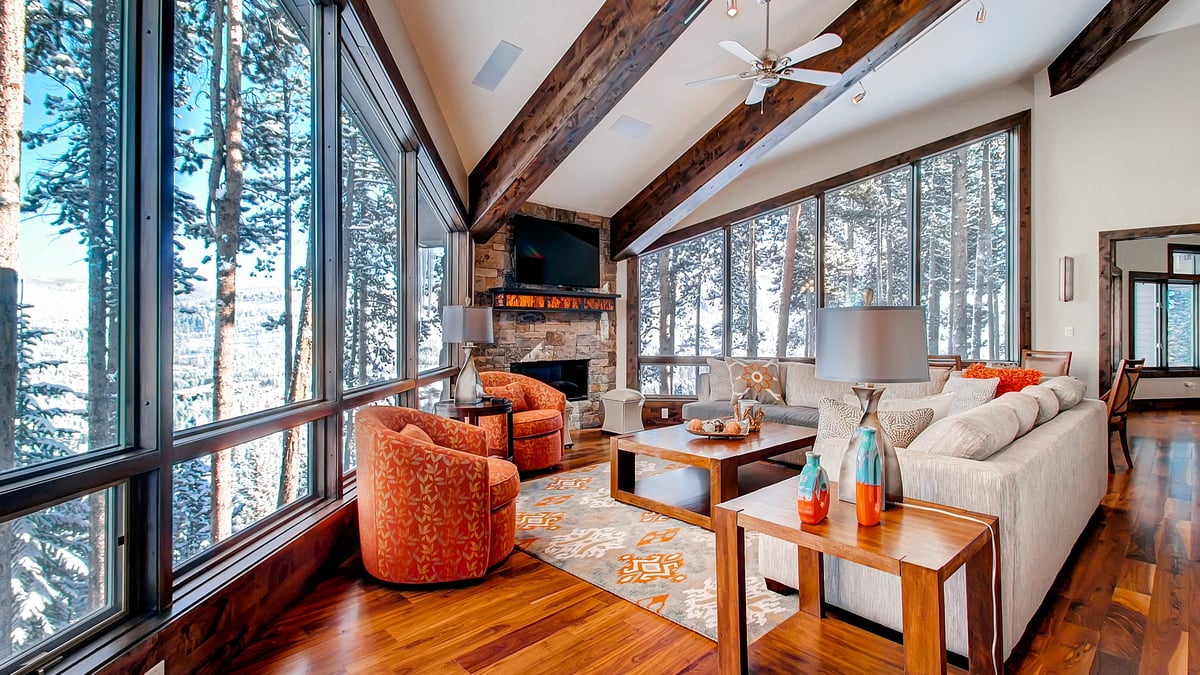 Great room with fireplace and wooded views - Image 4