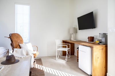 Front casita room: king bed, smart TV, desk with printer, mini fridge