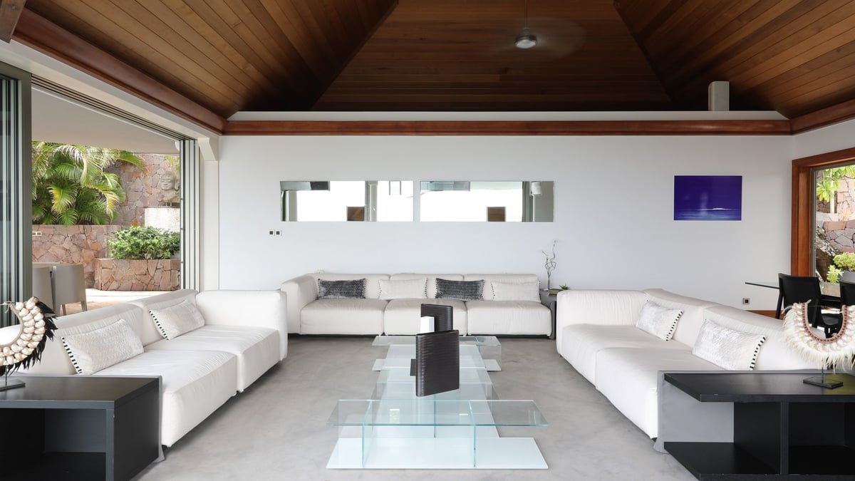 Living Area: In a separate bungalow opening to the pool deck - rattan couches with black fabric and  - Image 23