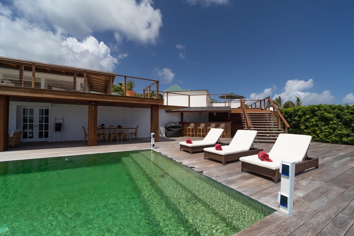 Terrace & Pool: A large terrace surrounds the oversized swimming pool as well as sun beds and deckch - Image 3