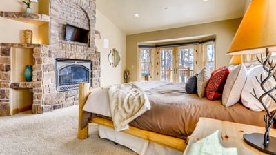 King Suite with fireplace, TV, deck access