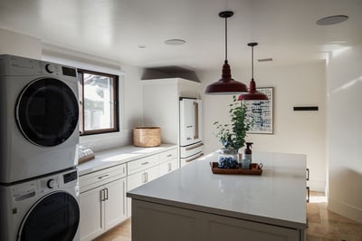 Large laundry room with the 4th full size fridge on property