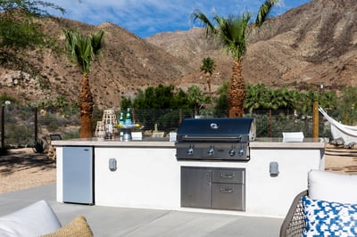 Grill and mini fridge at the backyard pool.