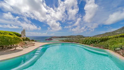 Pool & Terrace: Located on a lower level of the property. Large heated pool facing the view over the
