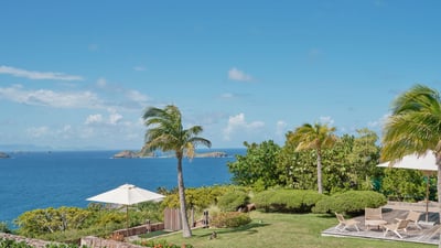 Outdoors: Beautiful garden surrounding the property. Panoramic views over the bay. Private parking a