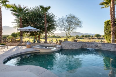 Great patio views - across the pool and golf course to the sunsetting over the mountains