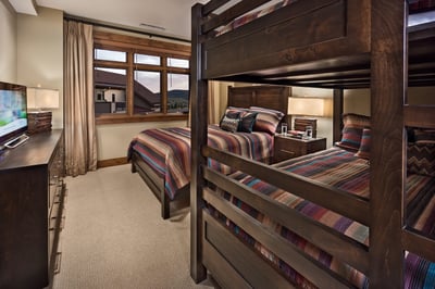 Family suite with a queen bed  and a queen over queen bunk
