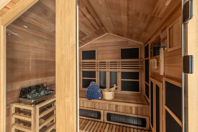 Unwind in your private wooden sauna, where warm cedar surrounds you and soft towels await your relax