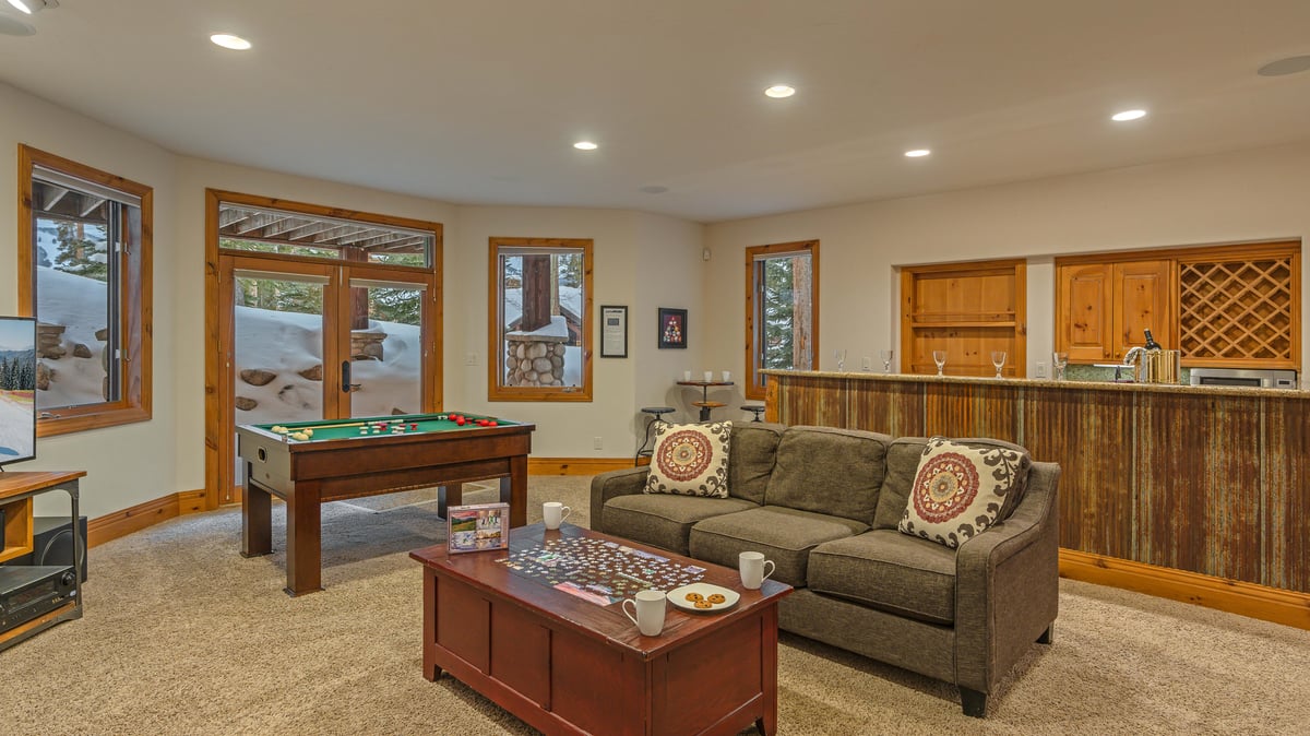 Family room on lower level with wet bar and bumper pool table - Image 19