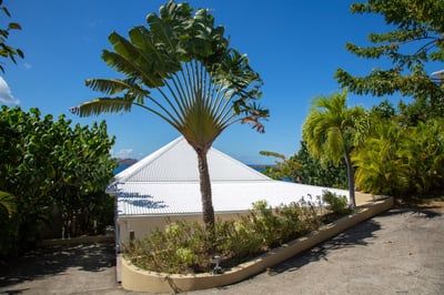 Outdoors: Tropical and lush gardens surround the villa. Dramatic ocean views 