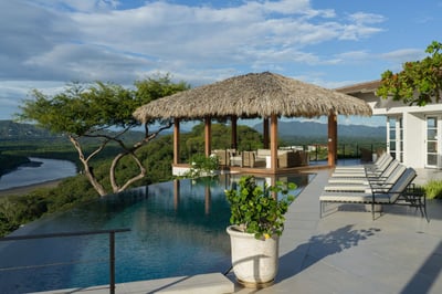 - Unwind in the infinity edge pool while gazing over beautiful green hills and winding river views
-