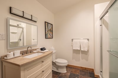 Your private bathroom features a spacious vanity and fresh towels, creating a clean sanctuary for yo